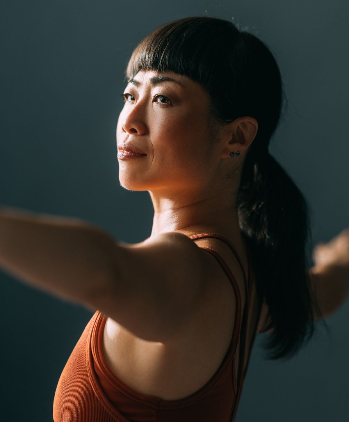 Alpharetta Hormone Treatment for Perimenopause model practicing yoga or meditation indoors.