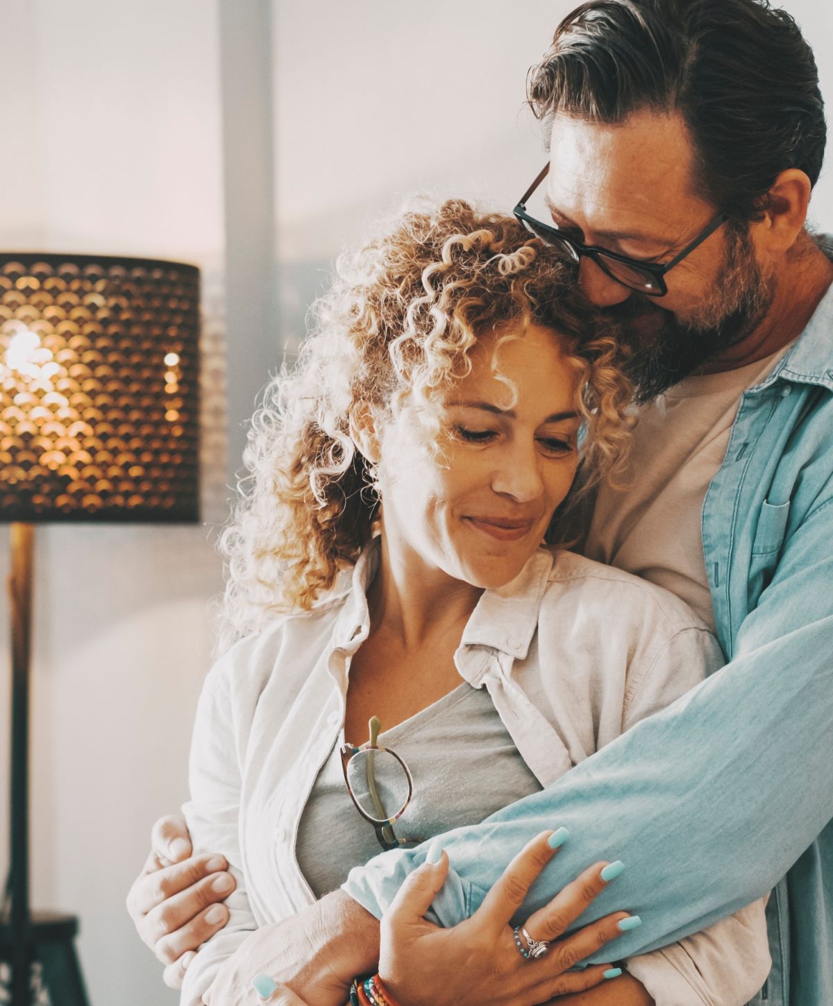 Alpharetta Vaginal Rejuvenation models embracing joyfully in a warm moment.